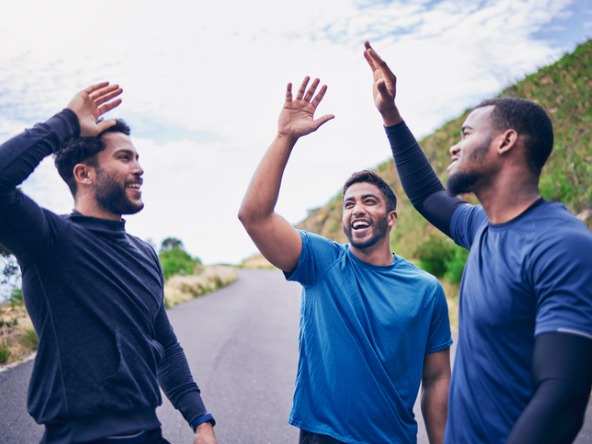 Men high-fiving